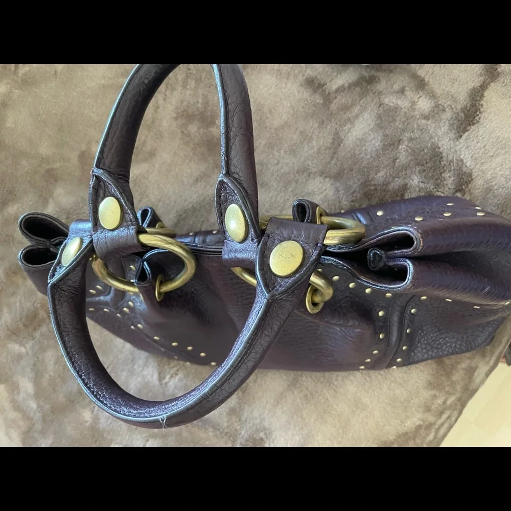 Kenneth Cole Purple Thick
Pebble Leather Studs Satchel Handbag
Purse PRE-OWNED - Picture 10 of 11